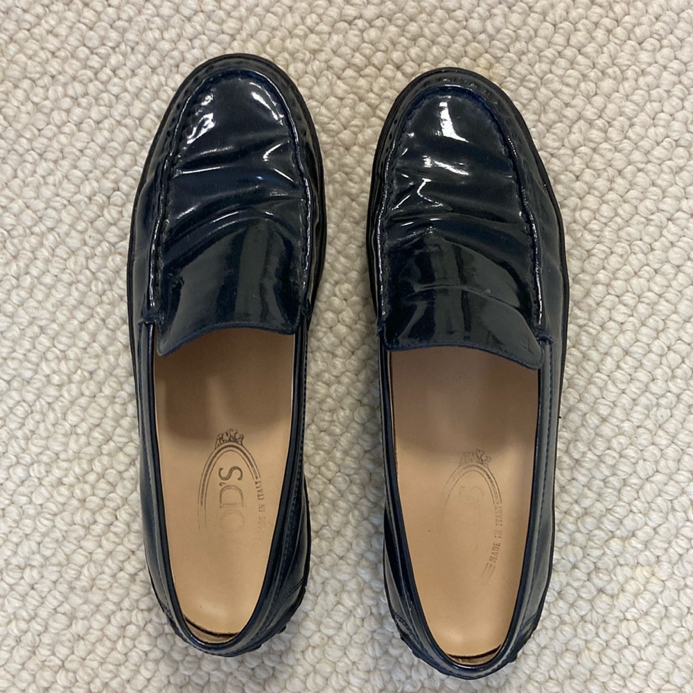 Tod’s navy patent leather loafers